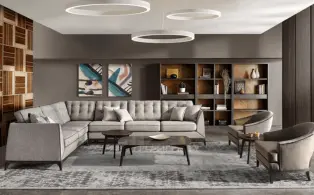 A stylish living room with a gray sectional sofa designed by top interior designers for a stunning.