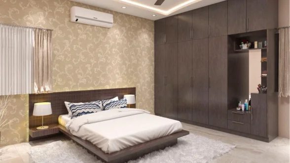 The interior of an AC bedroom features a bed, dresser, and window curtains on the wall panelling.