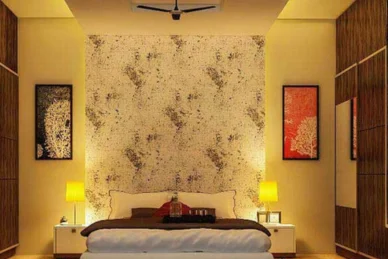 Spacious bedroom with a king-sized bed and a wallpapered accent wall exudes modern elegance.