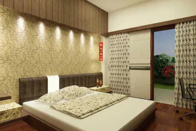 The bedroom is set with a comfy bed and attractive flower wallpaper, providing a warm atmosphere.
