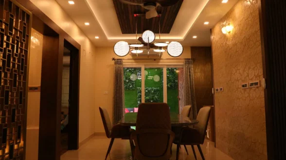 A ceiling fan and good lighting provide a cozy and welcoming ambiance in the dining area.