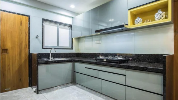 contemporary kitchen designs featuring sleek sinks, modern microwaves, and stylish fridges.