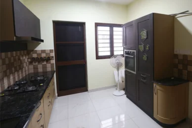 A refrigerator, oven, and microwave in a well-equipped kitchen support a healthy lifestyle.
