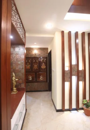 The architectural style of a Keralan residence incorporates an elaborately decorated pooja room.