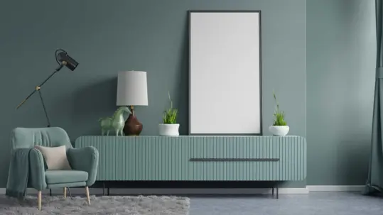 A stylish green sideboard with a mirror enhances the aesthetic appeal of the dressing room unit.