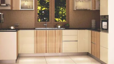 A modular kitchen with wooden cabinets, a sink, and an air-flow window creates an amazing look.
