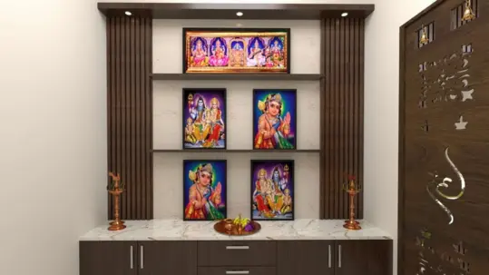 A pooja room with god pictures on a wooden shelf unit suggests the best interior designs for homes.