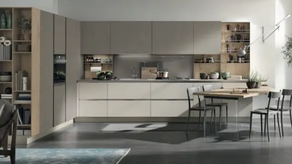 A sleek kitchen with a large island and dining table, embracing modern design and functionality.