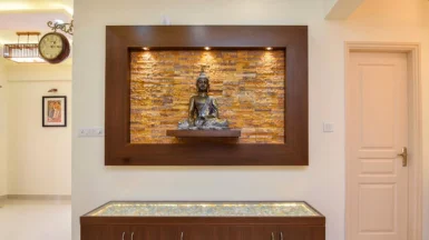 An subconscious chamber containing a big Buddha sculpture mounted on the wall in the middle.