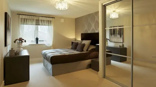 In the bedroom, one can establish a comfortable environment with a bed and mirror-wardrobes.