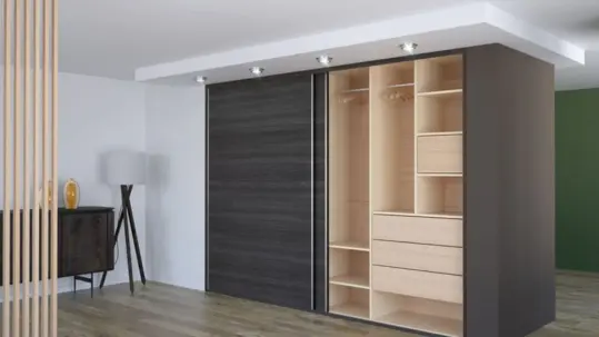 The sliding wardrobe and wooden flooring give this sleek bedroom a modern interior design.