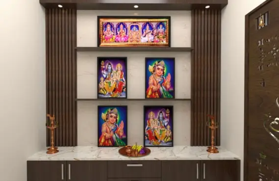 A pooja room with god pictures on a wooden shelf unit suggests the best interior designs for homes