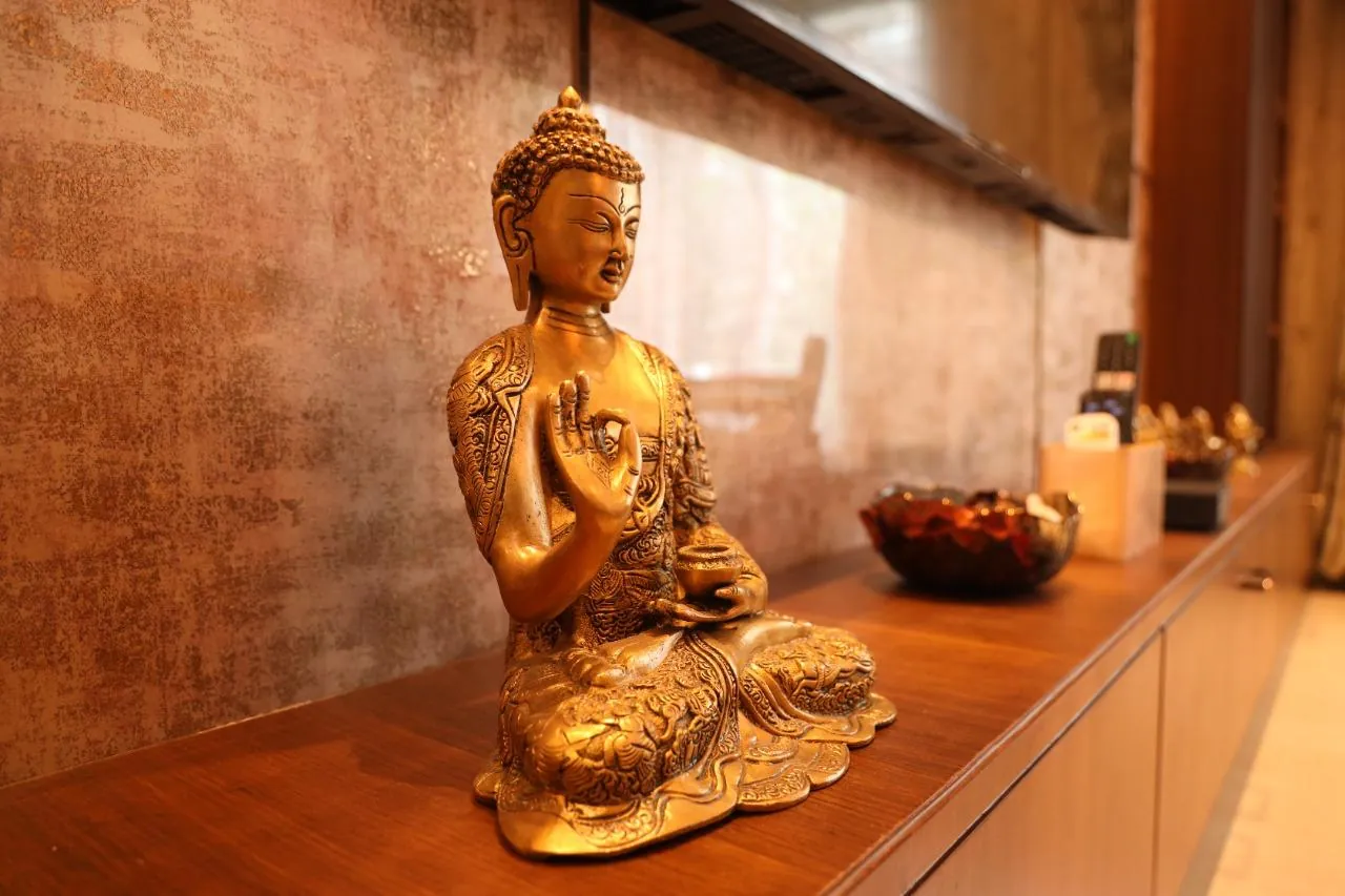 Detailed brass Buddha decor in a RICCO interior